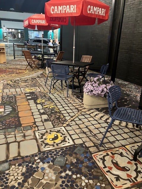 Photo of table and chairs with umbrellas
