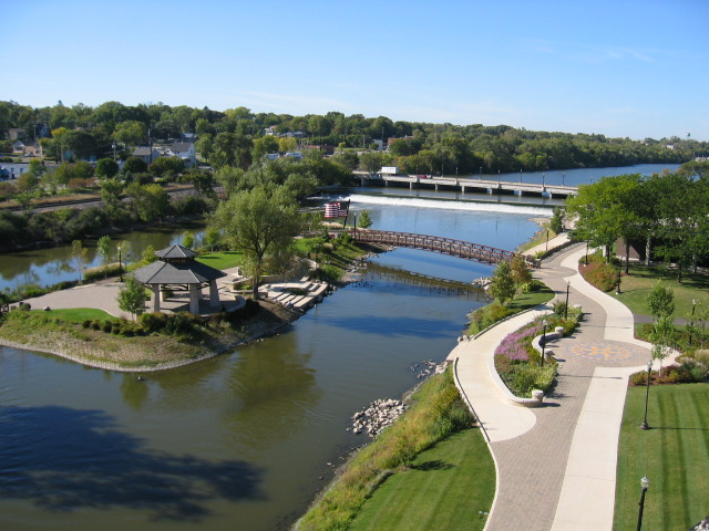 aerial view of river with grassy bank and bike path