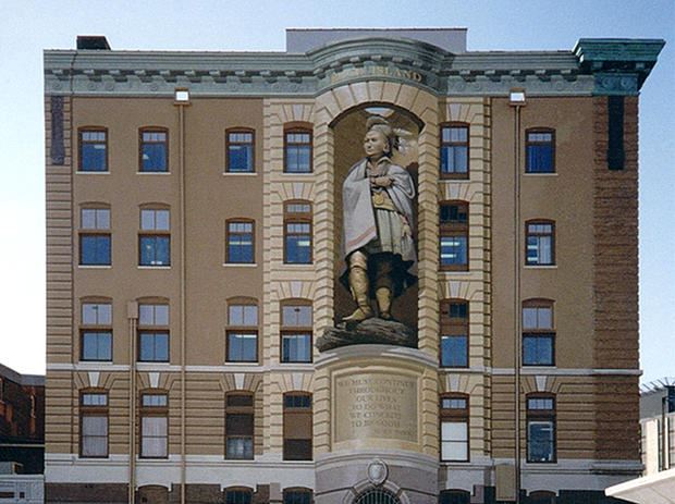 mural of black hawk native american on 3 story building