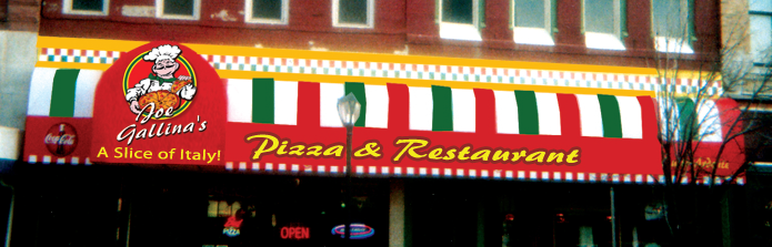exterior of pizza restaurant with striped awning of red, white, and green