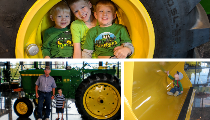 three young boys sitting inside a tractor tire hub