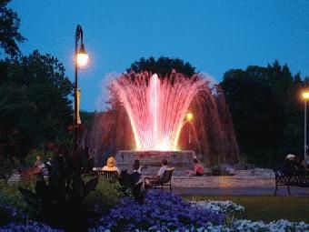 fountain lit up at night
