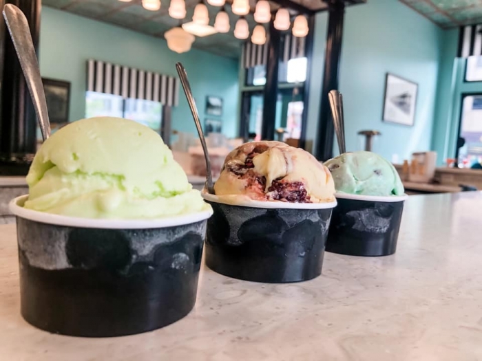 3 dishes of ice cream on marble counter