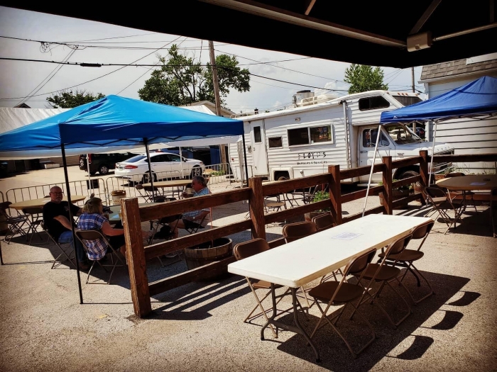 outdoor picnic table seating with food truck