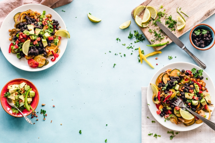two bowls of a fancy black bean chopped taco salad
