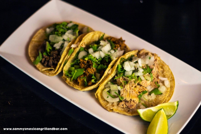 3 soft corn shell taco with shredded beef, onion, and cilantro