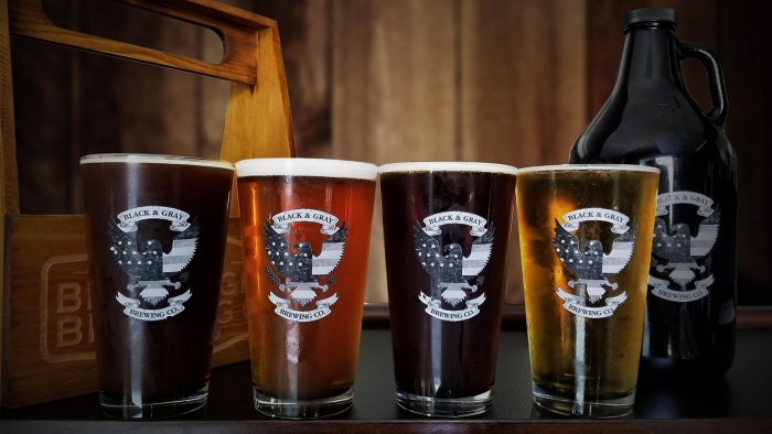flight of four beers light to dark