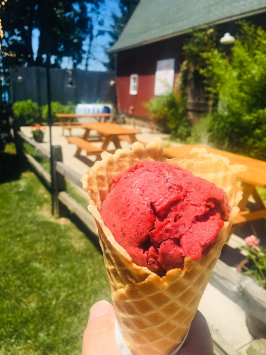 waffle cone with bright fuscia-colored ice cream