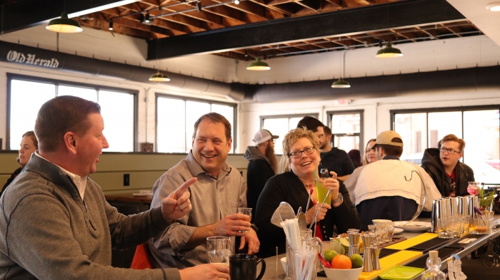 people sitting at a bar