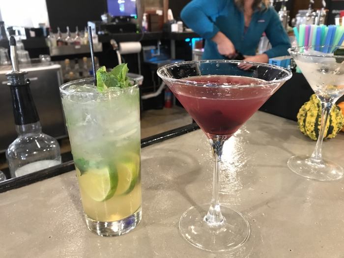mojito and purple martini on a bar