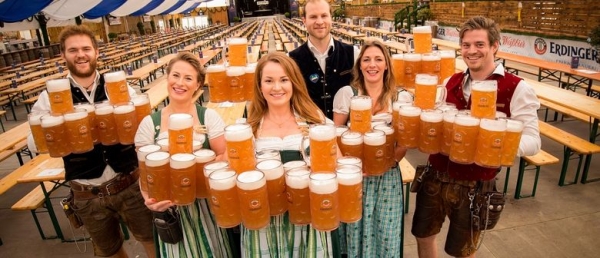 waitstaff in Munich holding beer steins