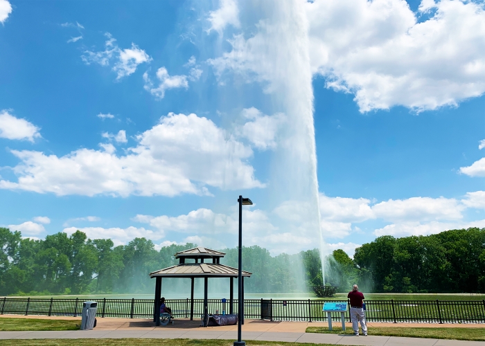 park with giant fountain geyser shooing upward with gazebo