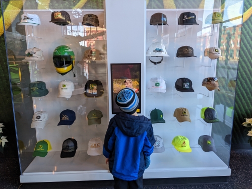 display of John Deere hats