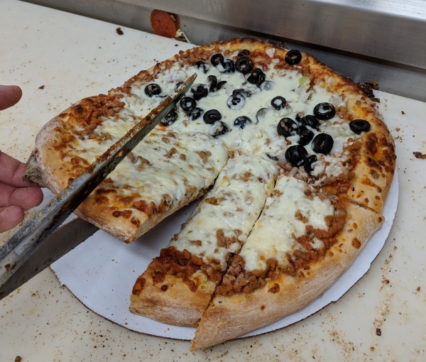https://visitquadcities.com/images/made/assets/uploads/images/Quad-Cities_pizza.cutting_slices__600_510.jpg