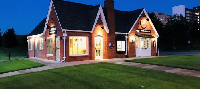 outdoor night picture of coffee shop red brick exterior
