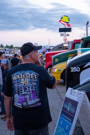 Man looking at semi-trucks at the I-80 Truck Stop during the Truckers Jamboree.