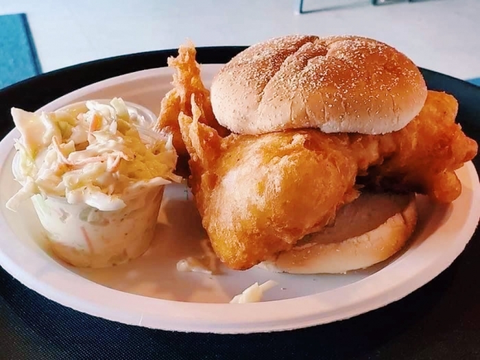 battered fish fillet on bun served with coleslaw