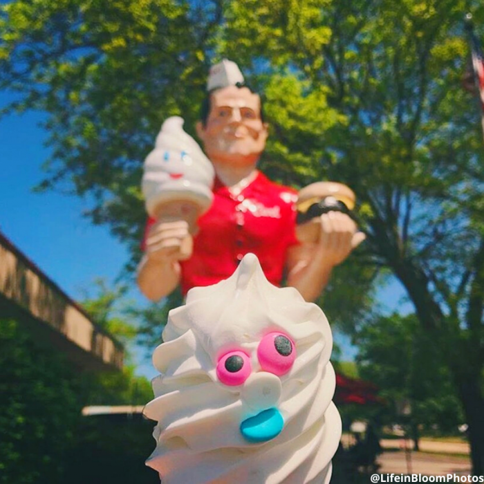 statue holding ice cream cone