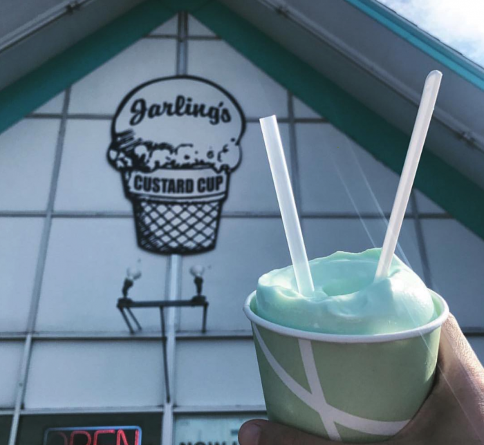hand holding blue milkshake