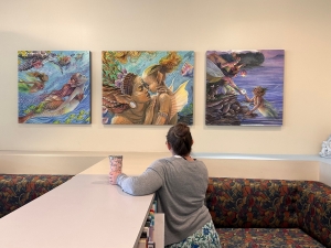 looking at 3 paintings of wall