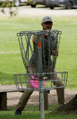 man behind disc gokf basket