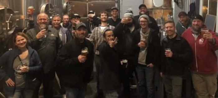 group of craft brewers in brewery