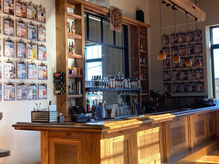 rustic bar room with tall windows